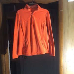Orange 1/4 zip up athletic jacket. Size XL.